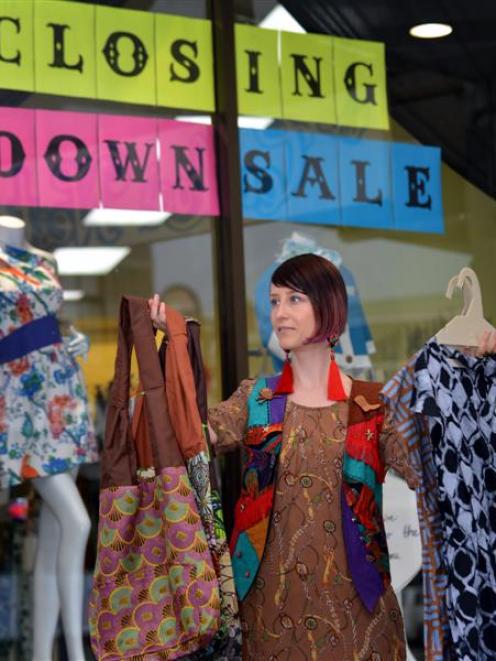 The Cuckoo's Nest manager Tannia Lee  holds fair trade  clothing yesterday outside the Dunedin...