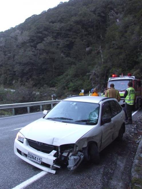 The driver of this  car escaped injury when  it crashed into a culvert on the  Haast Pass road...