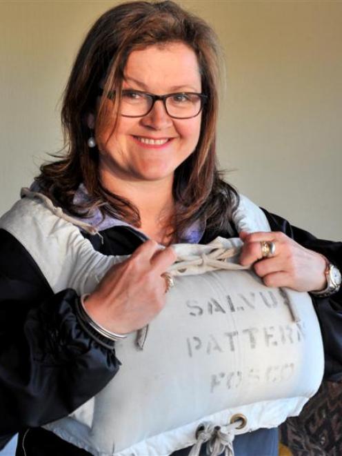 The Drowning Country film-maker Caroline Fitzgerald with a kapok-filled life jacket in Dunedin...
