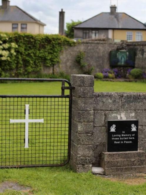 The entrance to the site of a mass grave of hundreds of children who died in the former Bons...