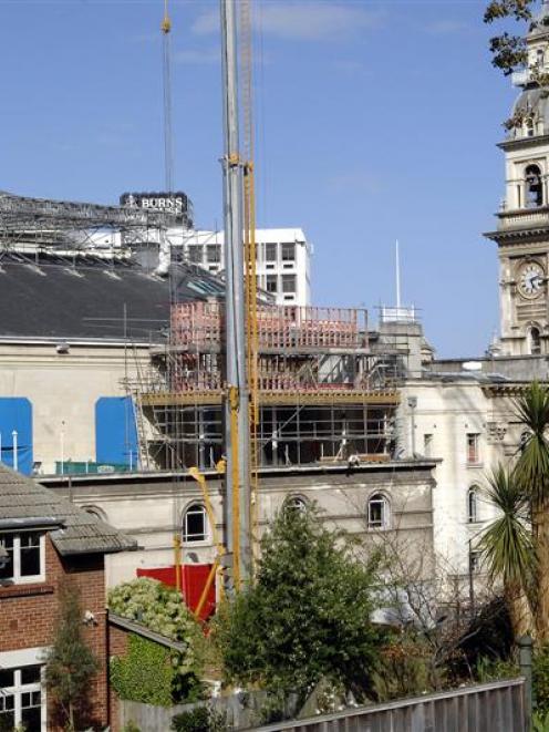 The extension being built on to the Dunedin Centre,  with the town hall's tarpaulin-covered...