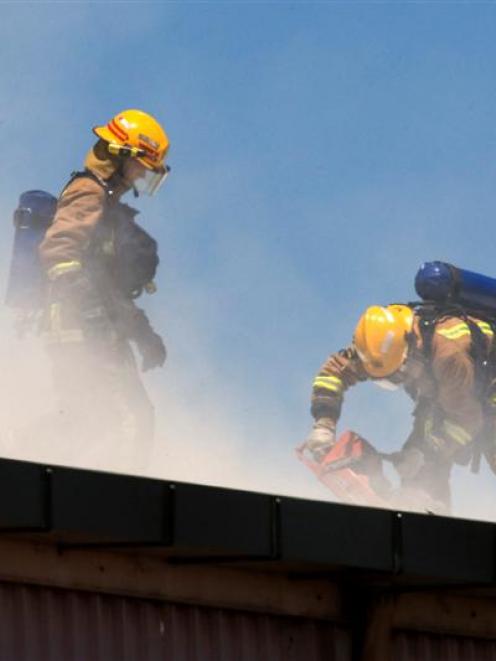 The fire service fighting a major fire at Paper Reclaim, Penrose, Auckland today. Photo by David...