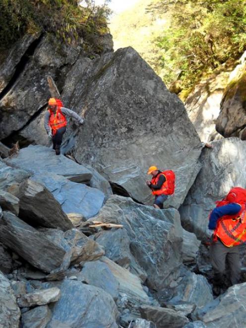 The Fox Glacier alpine cliff rescue team searches the upper Haast gorge this week. Photo supplied.