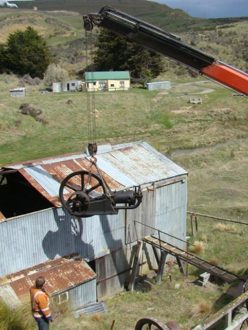 The gold stamp battery engine being lifted out of a historic building at Macraes mine on Thursday...
