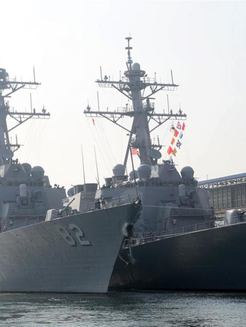 The guided missile destroyers USS Lassen (DDG 82) and USS Fitzgerald (DDG62) are seen at a South...