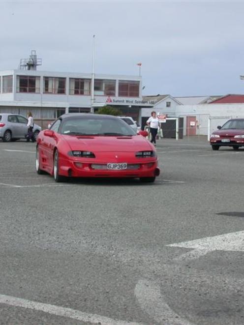 The last shift-workers leave the Summit Wool Spinners' employees' car park yesterday afternoon....