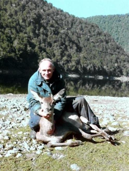 The late Jim Kane with a deer shot in Fiordland during the pioneering days of the venison...