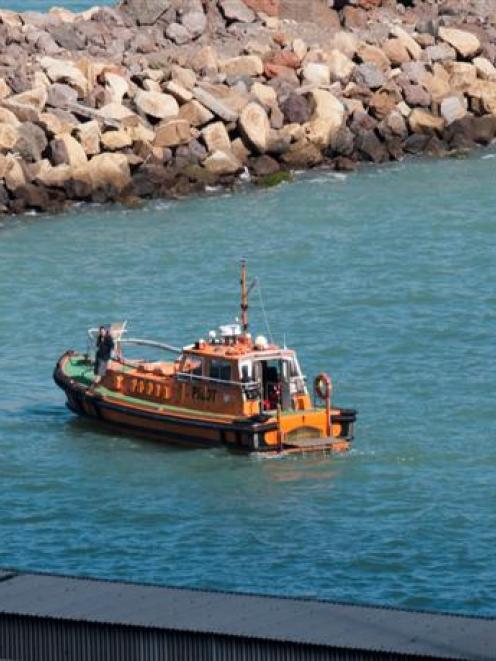 The LPC Pilot boat assists divers near the cruise ship Volendam which lost two crew members...