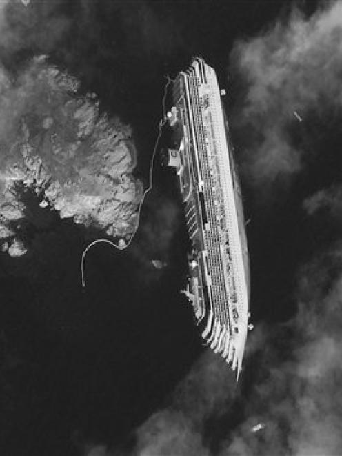 The luxury cruise ship Costa Concordia, which ran aground the Tuscan tiny island of Isola del...