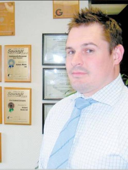 Fishers Meats Ltd chief executive Nick Fisher proudly displays the many awards his company has...