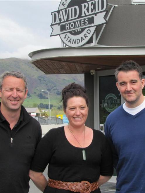 The new Wanaka managers of David Reid Homes, Paul and Leigh-Anne Fox, with new franchise owner...