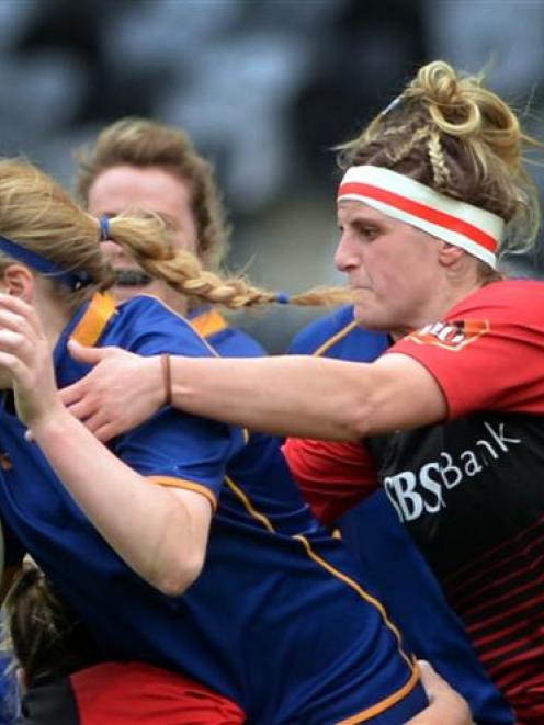 The Otago Spirit's Claire Richardson tries to escape the clutches of Canterbury's Leysa Matity...
