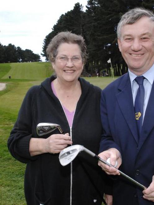 The outgoing president of Women's Goilf Otago, Glenys Rowley, and Alistair Hinsley, a member of...