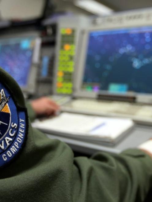 The patch of the NATO AWACS (Airborne Warning and Control Systems) aircraft is seen attached to...