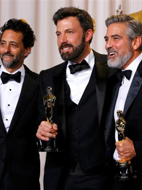 The producers of "Argo, the winner for best picture, Grant Heslov, Ben Affleck and George Clooney...