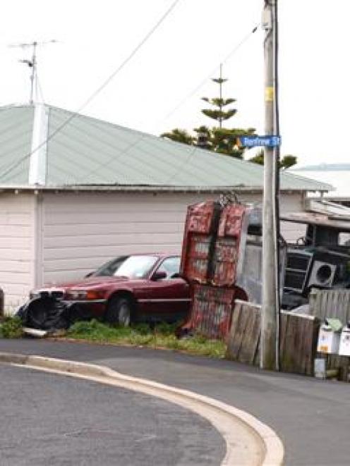The property at  Renfrew St, in Mornington, and some of the car bodies in the garden. Photo by...