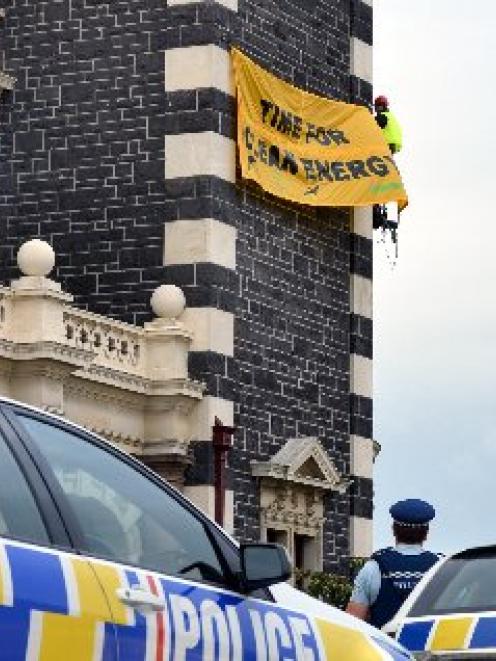 The protest banner three climbers unfurled  on behalf of  Greenpeace and Oil Free Otago on...