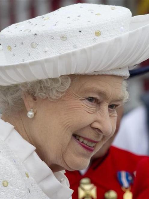 The Queen before embarking at Chelsea Wharf yesterday to travel down the Thames at the centre of...