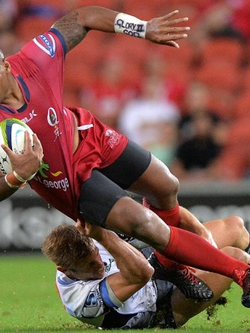 The Reds' Samu Kerevi is caught by a Force tackler. Photo: Getty Images