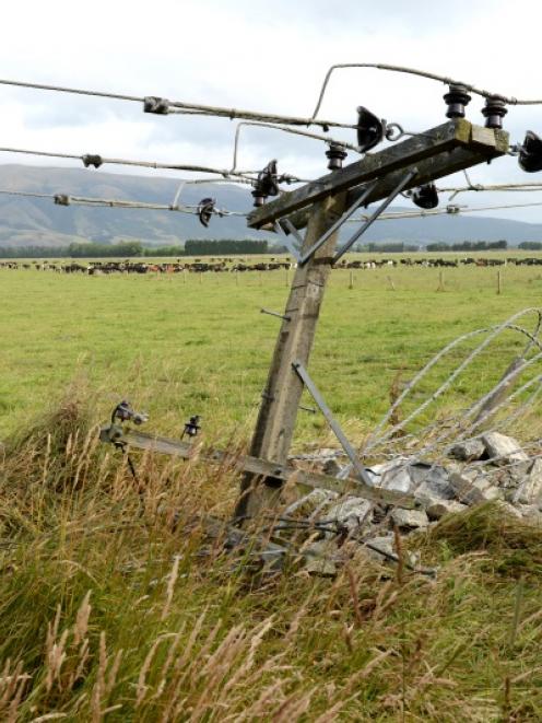 The remains of a power pole stand at the scene of a fatal crash in Centre Rd at Momona, near...