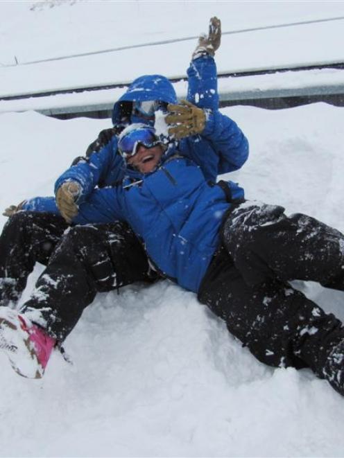 The Remarkables lifts department staff Tommy Leek (left) and Deanna Hudson enjoy   yesterday's...