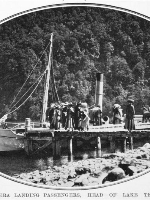 The s.s. Tawera landing passengers near Glade House, at the head of Lake Te Anau. -<i>Otago...