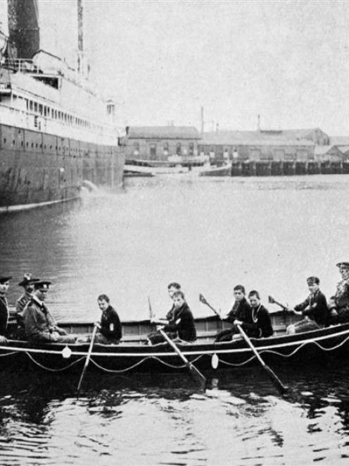 The Sea Scouts' new boat Foam Queen near the Dunedin wharf, with the first crew of Sea Scouts in...