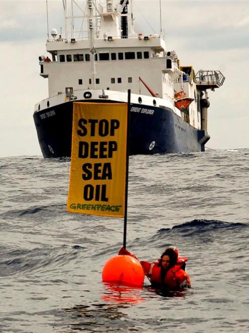 The seismic survey vessel <i>Orient Explorer</i> bears down on Greenpeace protester Kylee Mathews...