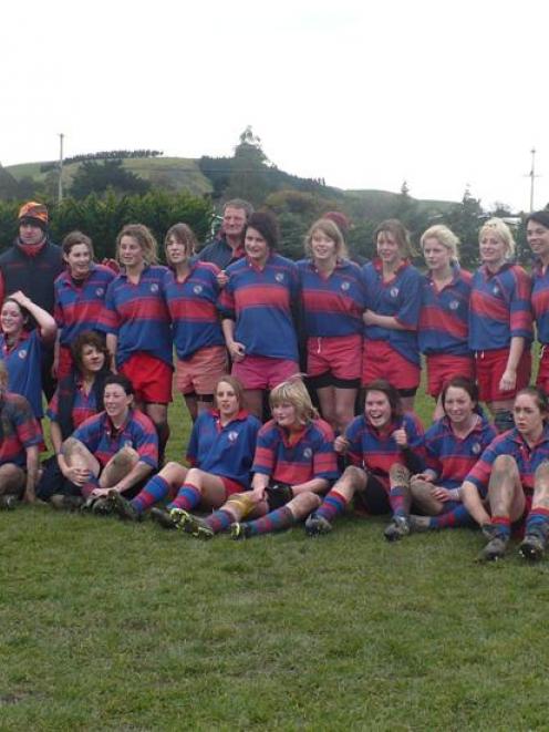 The South Otago First XV celebrates its victory in the girls rugby festival in Oamaru.