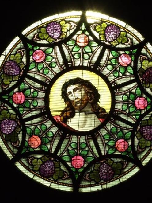 The stained glass window is one of the distinctive features of the building. Photos by Lynda van...