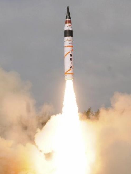 The surface-to-surface Agni V missile is launched from off the east coast of India.  Photo by...