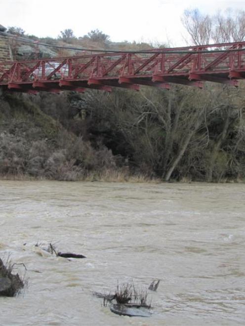 The swollen Manuherikia River at the Daniel O'Connell bridge near Ophir yesterday afternoon....