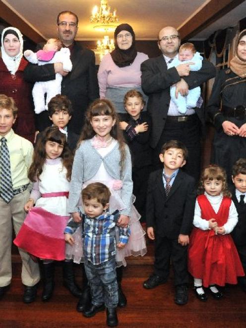 The Taha family, from Syria, are (top row, from left) Lina, Heba (8 weeks) Mouhannod, Izdehar,...