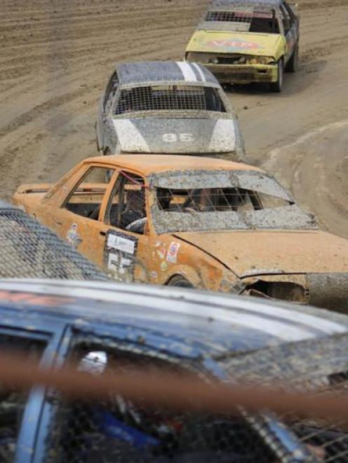 The Team Greenfingers car  (orange)  from  Ranfurly, takes a corner as the team heads towards ...