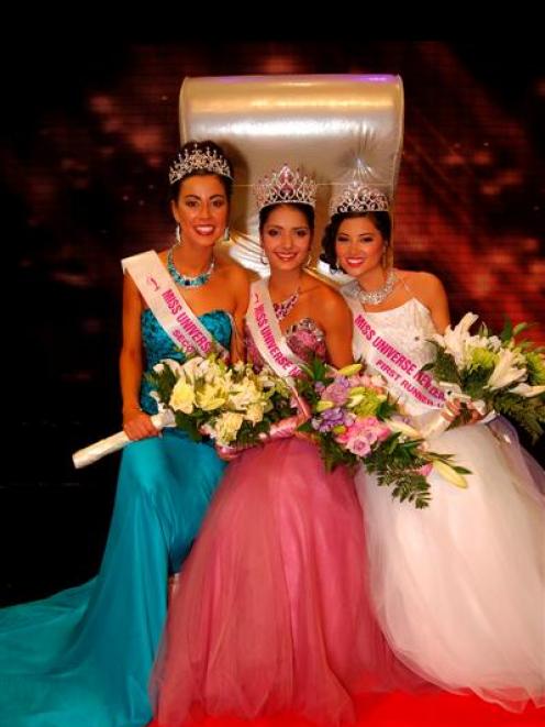 The top three contestants at the Miss Universe New Zealand pageant pose at Sky City Theatre,...