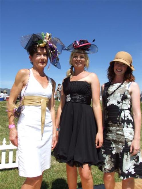 The top trio in the Fashions on the Field contest at the Cromwell Races, winner Josie Mitchell,...