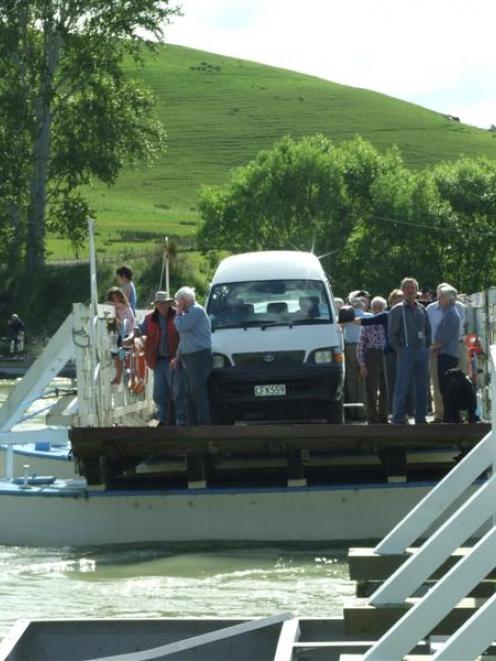 The Tuapeka Mouth Ferry takes a group across the Clutha River last year.