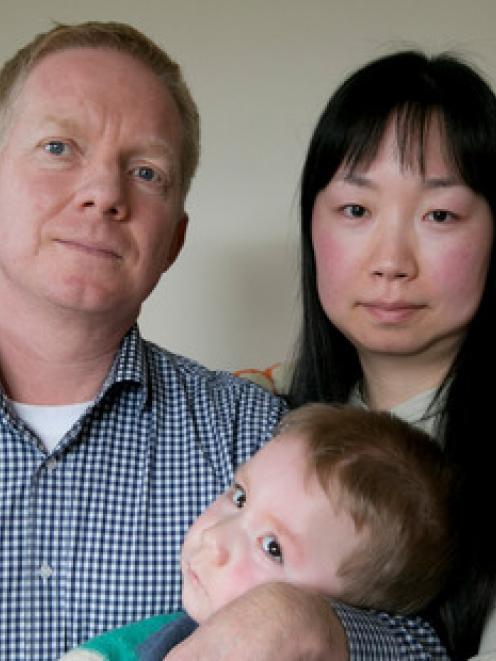 The victim of a misdiagnosis which caused brain damage, William Burton, with his parents. Photo...