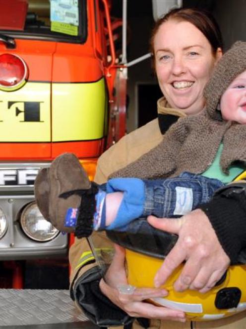 The Waikouaiti fire brigade wants to offer babysitting for its firefighters, like Katrina Hurst,...