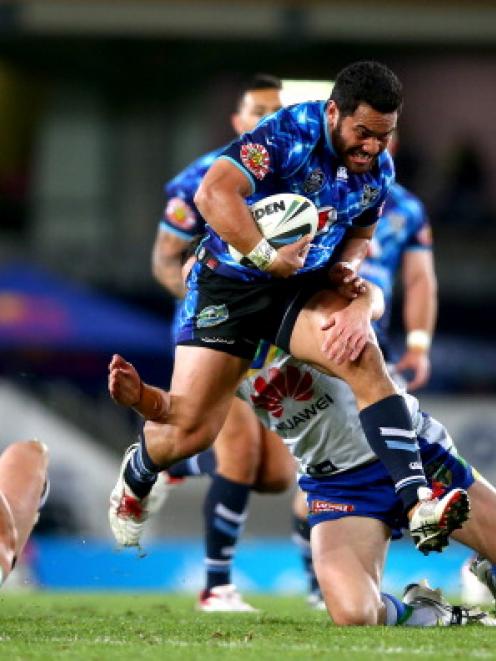 The Warriors' Konrad Hurrell breaks through the Raiders defence. Photo Getty