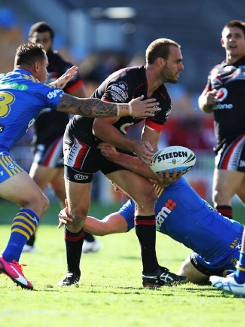 The Warriors' Simon Mannering looks to offload in the tackle against the Parramatta Eels. Photo...