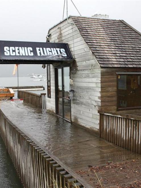 The Water and Wings floatplane office on Lake Te Anau was evacuated as the lake threatened to...