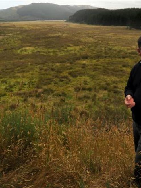 The wetland area behind Otago Fish and Game Council operations manager Ian Hadland should be...