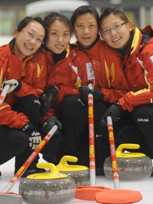 The world champion Chinese women's team (from left) Yan Zhou, Qingshuang Yue, Yin Liu and skip...