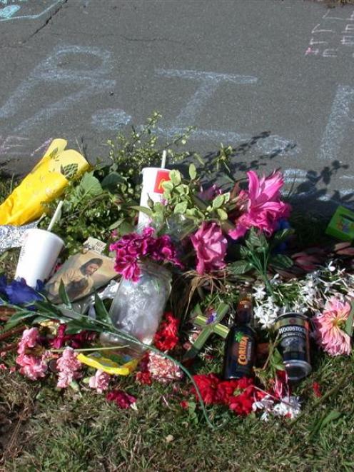 These flowers and messages were left on the footpath in Exe St, after the stabbing of Oamaru...