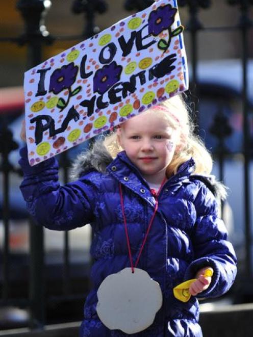 Third-generation playcentre child Laura Allison (5) shows her support for the early childhood...