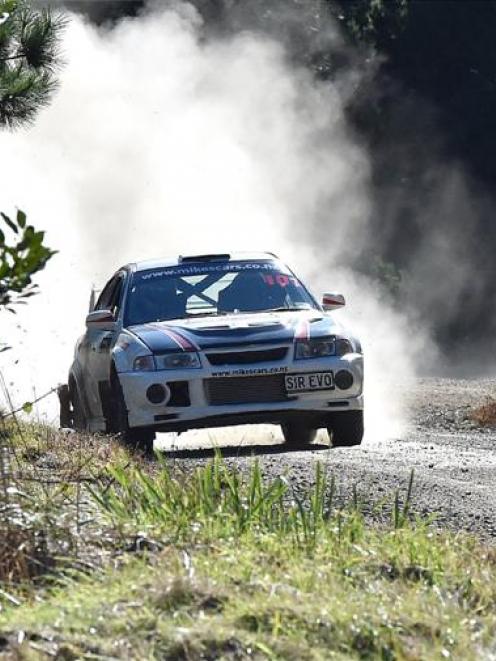 Third place finisher Mike Wellington guns his Mitsubishi out of the final corner of the Whare...