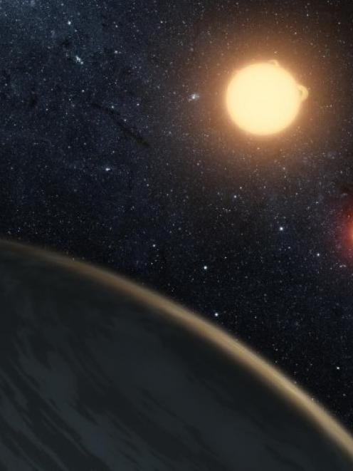 This artist's concept illustrates Kepler-16b, the first planet known to definitively orbit two...