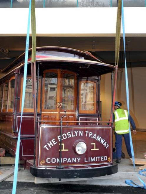 This painstakingly restored electric tram is moved back to the Otago Settlers Museum yesterday....