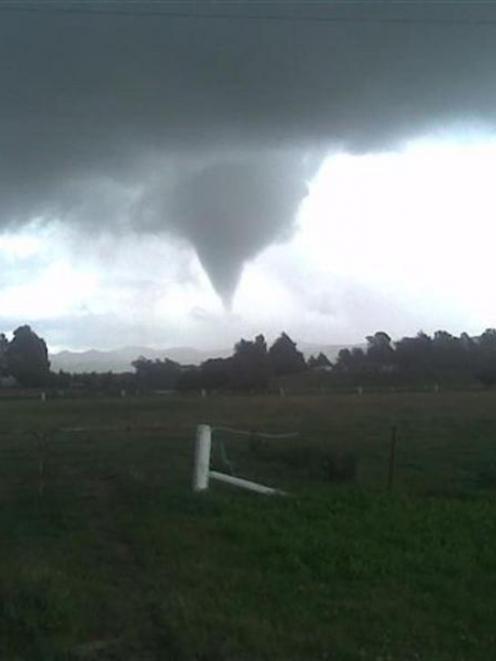 This picture of the twister was taken on a cell phone of  by Waikouaiti electrician Alan Brennan.